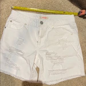 Distressed white jean shorts